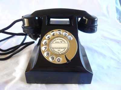 A BRASS DIAL BAKELITE TELEPHONE